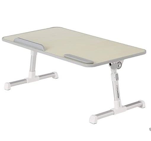 Photo 1 of Amazon Basics Adjustable Laptop Tray Table - Lap Desk Fits up to 17-Inch Laptop 