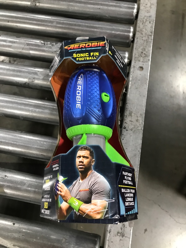 Photo 2 of Aerobie Sonic Fin Football, Aerodynamic Russel Wilson Foam Football Toy, Outdoor Games for Kids and Adults Aged 8 and Up