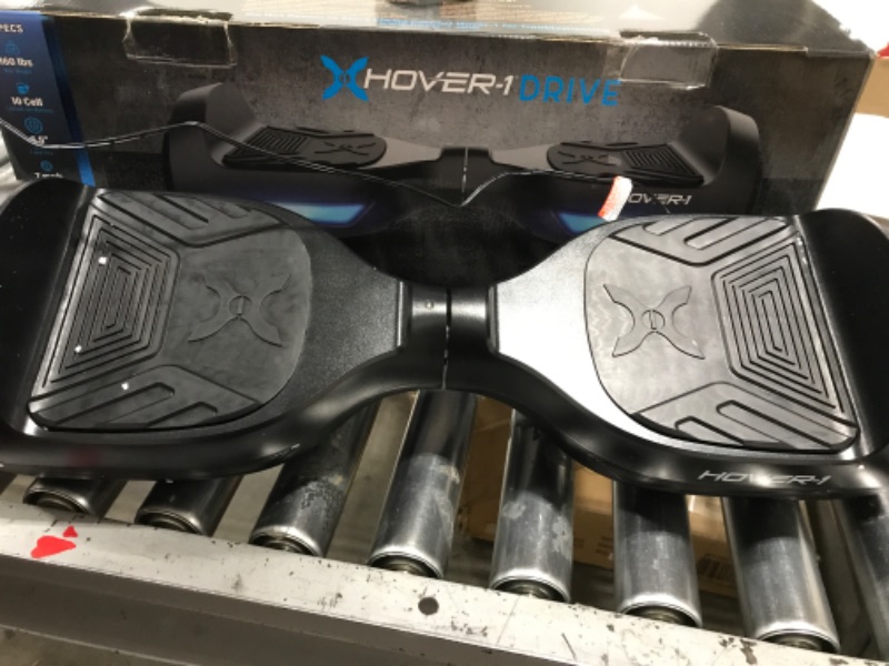 Photo 2 of Hover-1 Drive Electric Hoverboard | 7MPH Top Speed, 3 Mile Range, Long Lasting Lithium-Ion Battery, 6HR Full-Charge, Path Illuminating LED Lights Black
