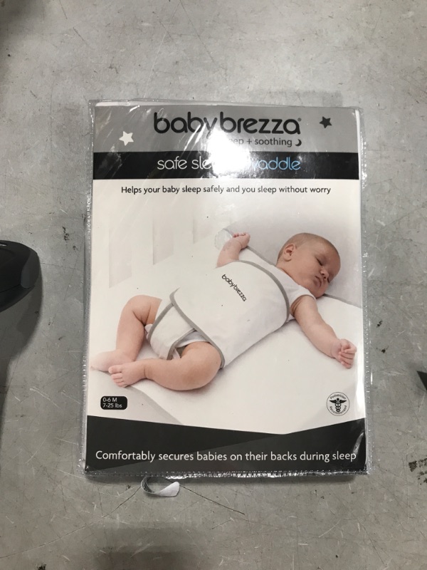 Photo 2 of Baby Brezza Safe Sleep Swaddle Blanket for Crib Safety for Newborns and Infants – Safe, Anti-Rollover Blanket in White, by Tranquilo Reste