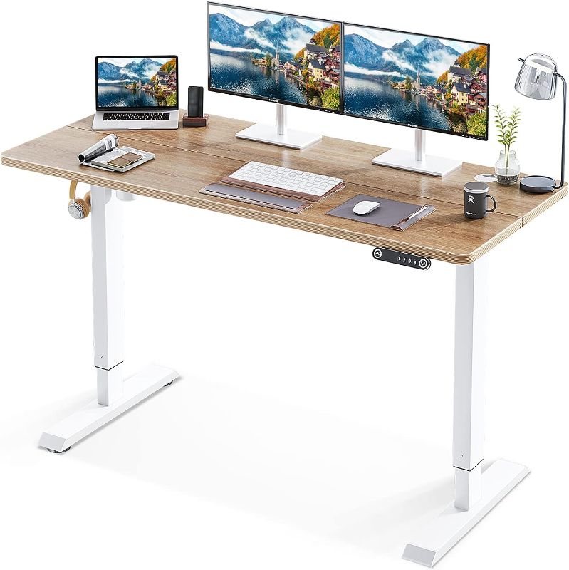 Photo 1 of KKL 55-inch Height Adjustable Electric Standing Desk, 55 x 28 Inches Stand Up Desk with Splice Board and Hook, Sit Stand Desk with Greige Top and White Frame
