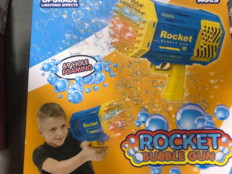 Photo 1 of Bubble Machine, Aiduy 69 Holes Bubble Maker with Bubble Solution for Kids Adults, Gifts for Birthday Wedding Party (Purple)
