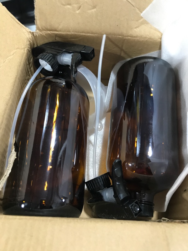 Photo 1 of 2 large brown glass dispensers with spray bottle tops and lids