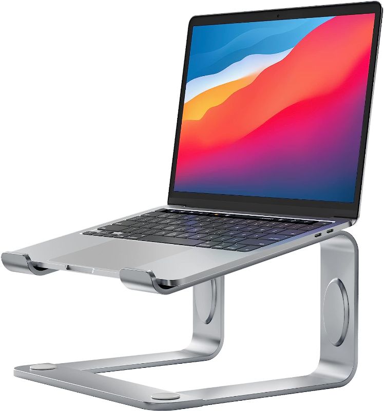 Photo 1 of LORYERGO Laptop Stand, Ergonomic Laptop Riser Laptop Mount for Desk, Notebook Stand Compatible with Most 10-15.6” Laptops, Silver
