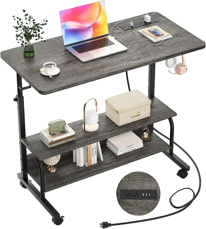 Photo 1 of  Height Adjustable Standing Desk with Power Outlets, 32" Manual Stand Up Desk with Storage Shelves Small Mobile Rolling Computer Desk Portable Laptop Table with Wheels for Home Office, Grey Oak 