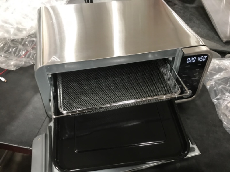 Photo 3 of Ninja SP101 Digital Air Fry Countertop Oven with 8-in-1 Functionality, Flip Up & Away Capability for Storage Space, with Air Fry Basket, Wire Rack & Crumb Tray, Silver
