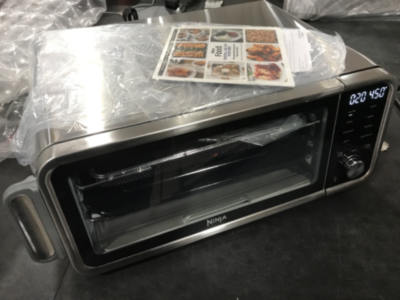 Photo 2 of Ninja SP101 Digital Air Fry Countertop Oven with 8-in-1 Functionality, Flip Up & Away Capability for Storage Space, with Air Fry Basket, Wire Rack & Crumb Tray, Silver
