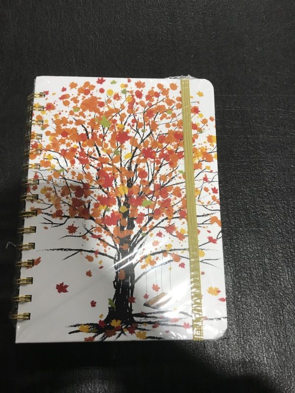 Photo 2 of Ymumuda 2023 Planner, Weekly Monthly Planner 2023, 12-Month School Planner from JAN.2023 to DEC.2023, 8.4" X 6", Spiral Planner Notebook with Stickers, Elastic Closure, Inner Pocket, Coated Tabs, Colorful Tree Colorful Maple