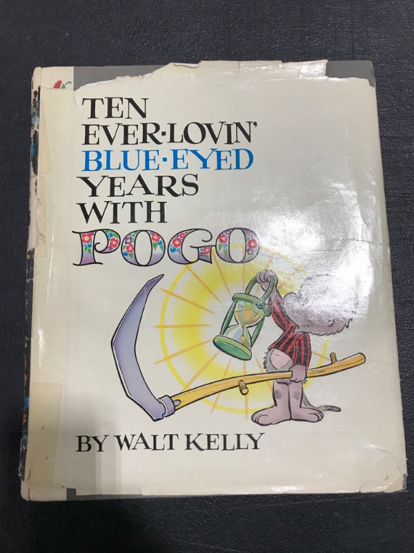 Photo 2 of "Ten Ever Lovin' Blue Eyed Years with Pogo" by Walt Kelly. HARDCOVER. VINTAGE 1959. PRIOR USE. DUST COVER DAMAGE. 
