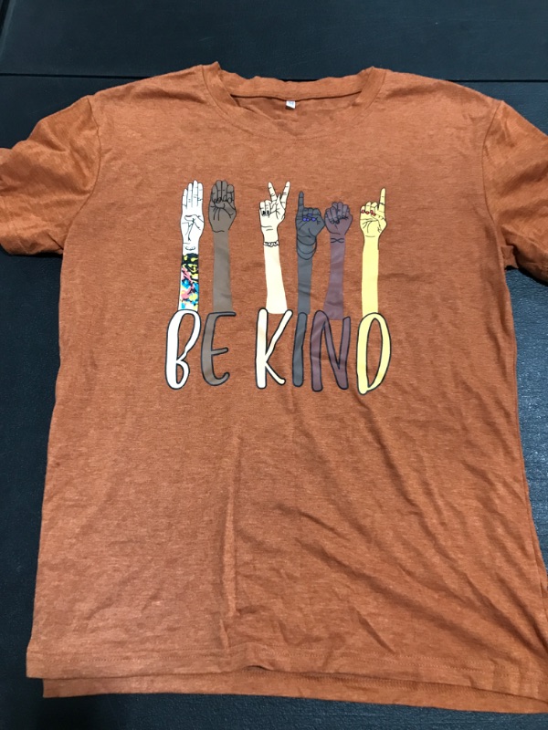 Photo 1 of BE KIND T-SHIRT. COPPER. SIZE MEDIUM. PRIOR USE. 