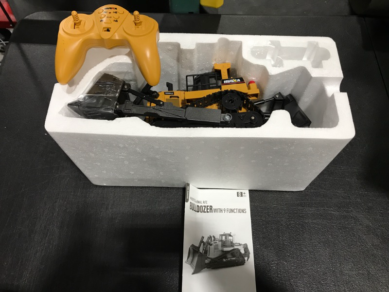 Photo 2 of fisca Remote Control Bulldozer RC 1/16 Full Functional Construction Vehicle, 2.4Ghz 9 Channel Dozer Front Loader Toy with Light and Sound for Kids Age 6, 7, 8, 9, 10 and Up Years Old