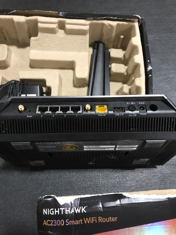 Photo 1 of NETGEAR Nighthawk Smart WiFi Router (R7000P) - AC2300 Wireless Speed (up to 2300 Mbps) | Up to 2000 sq ft Coverage & 35 Devices | 4 x 1G Ethernet and 2 USB ports | Armor Security. PRIOR USE. BOX DAMAGE. 
