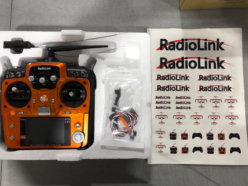 Photo 2 of Radiolink AT10II 12 Channels RC Transmitter and Receiver R12DS 2.4GHz Radio Remote, Voltage Telemetry for RC Airplane, FPV Racing Drone, Quad, Helicopter, Car and Boat (Mode 2 Left-Hand Throttle) Orange