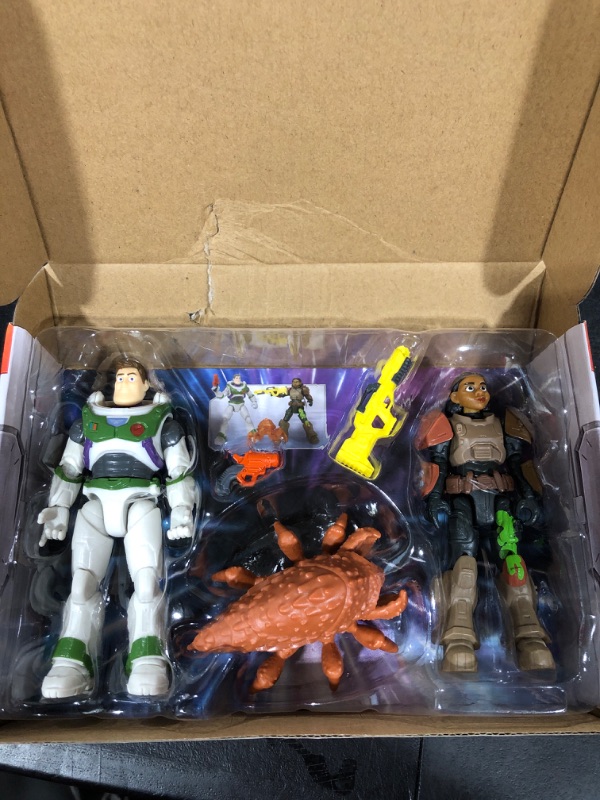 Photo 2 of Disney and Pixar Lightyear Toy Figures and Accessories, 5-in Scale Izzy & Buzz Figures, Oversized Bug & Blasters