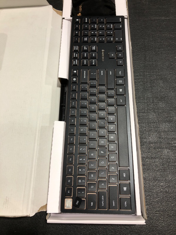 Photo 2 of CHERRY DW 9100 Slim Wireless Keyboard and Mouse Set Combo Rechargeable with SX Scissor Mechanism, Silent keystroke Quiet Typing with Thin Design for Work or Home Office. (Black & Bronze). OPEN BOX. LOOSE KEYBOARD KEYS. 