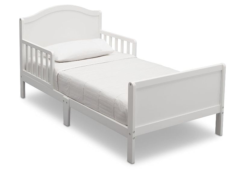 Photo 1 of Delta Children Bennett Toddler Bed, Bianca White + Delta Children Twinkle Galaxy Dual Sided Recycled Fiber Core Toddler Mattress (Bundle) Bianca White Crib + Mattress