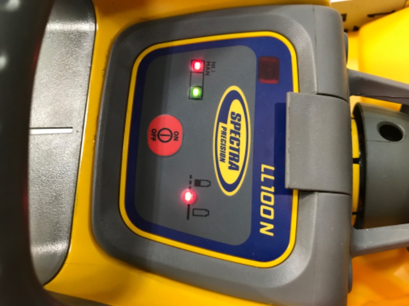 Photo 9 of **TURNS ON BUT DOESN'T FUNCTION** PARTS ONLY***
Spectra Precision LL100N-2 Laser Level Kit with HR320 Receiver and Clamp, 15' Grade Rod (Inches), Tripod, and System Case , Yellow
