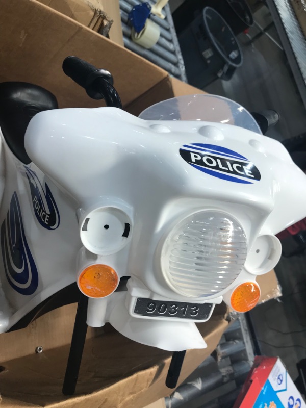 Photo 4 of ****FOR PARTS ONLY****
Ride On Motorcycle for Kids – 3-Wheel Battery Powered Motorbike for Kids Ages 3 -6 – Police Decals, Reverse, and Headlights by Lil’ Rider (White)