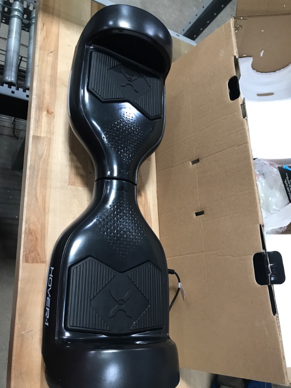 Photo 4 of ***DAMAGED*** Hover-1 Helix Electric Hoverboard | 7MPH Top Speed, 4 Mile Range, 6HR Full-Charge, Built-in Bluetooth Speaker, Rider Modes: Beginner to Expert Hoverboard Black