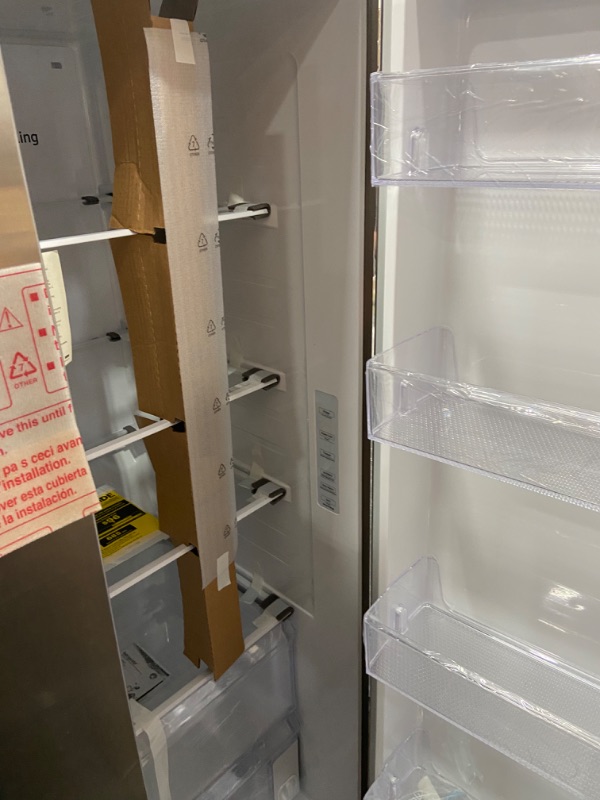 Photo 1 of Samsung 28-cu ft Smart Side-by-Side Refrigerator with Ice Maker 