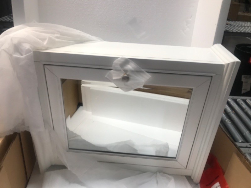Photo 1 of 24 in. W x 28 in. H Framed Rectangular Beveled Edge Bathroom Vanity Mirror in White finish
