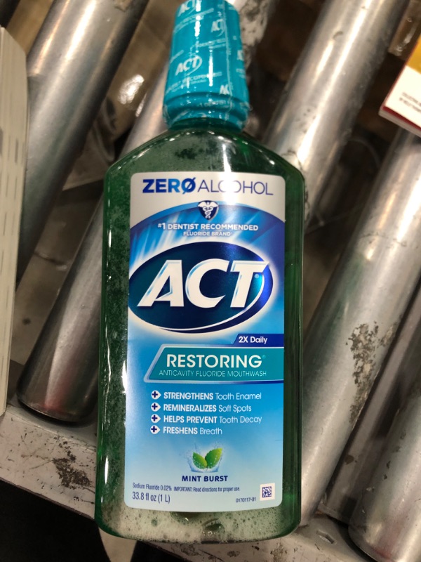 Photo 2 of ACT Restoring Zero Alcohol Fluoride Mouthwash 33.8 fl. oz. Strengthens Tooth Enamel, Mint Burst Green 33.8 Fl Oz (Pack of 1)