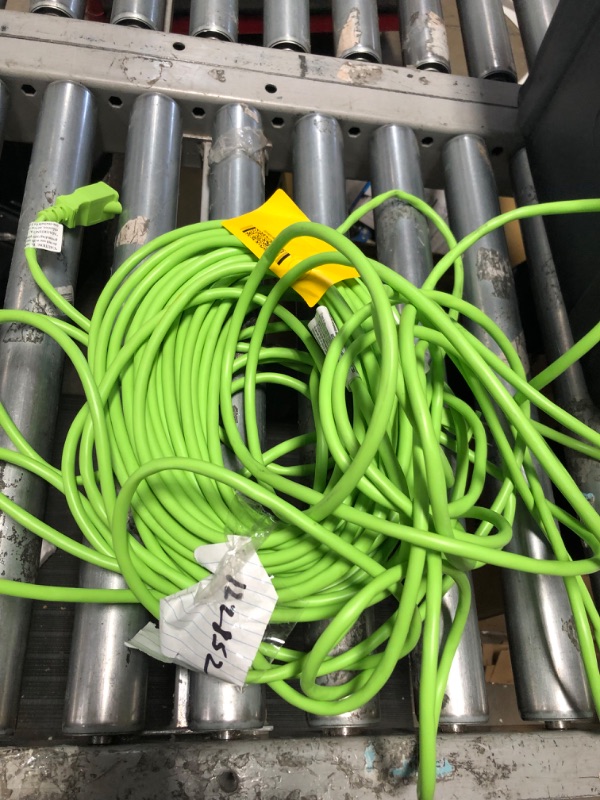 Photo 1 of **unbranded green extension cord size unknown