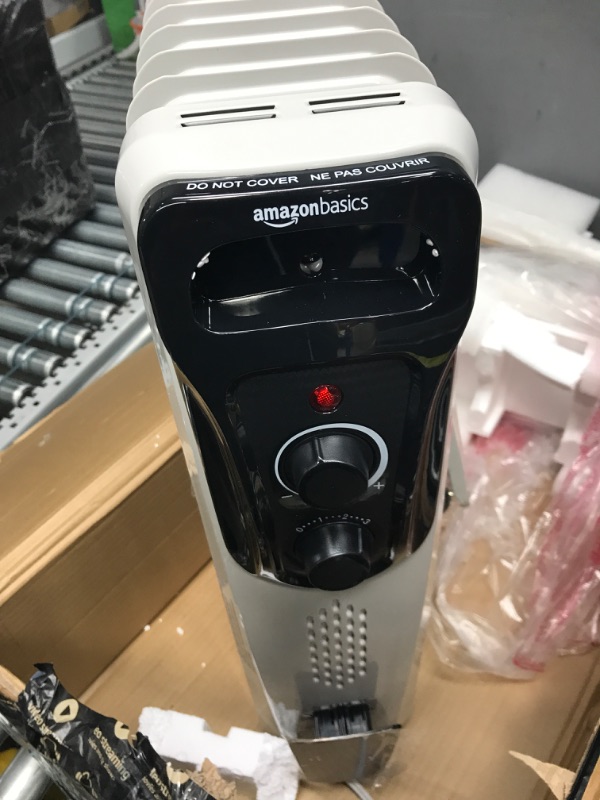 Photo 4 of ***NONFUNCTIONAL - FOR PARTS - SEE NOTES***
Amazon Basics Indoor Portable Radiator Heater - White