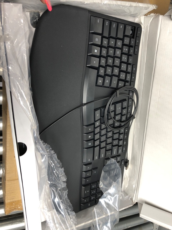 Photo 2 of Microsoft Ergonomic Keyboard - Black. Wired, Comfortable, Ergonomic Keyboard with Cushioned Wrist and Palm Support. Split Keyboard. Dedicated Office Key.