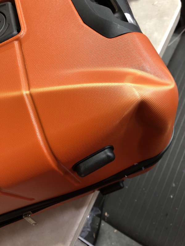 Photo 5 of * see images for damage *
Wrangler Smart Luggage Set with Cup Holder and USB Port, Burnt Orange, 3 Piece 3 Piece Set Burnt Orange