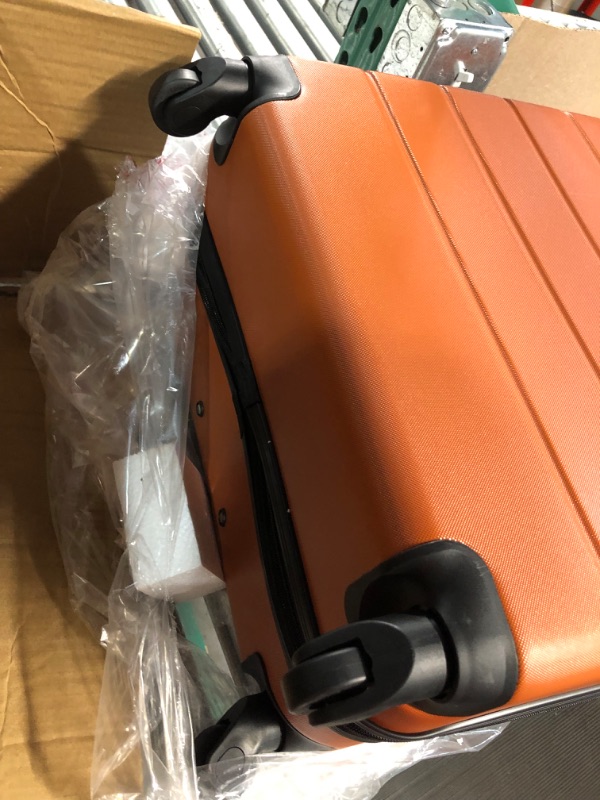 Photo 2 of * see images for damage *
Wrangler Smart Luggage Set with Cup Holder and USB Port, Burnt Orange, 3 Piece 3 Piece Set Burnt Orange