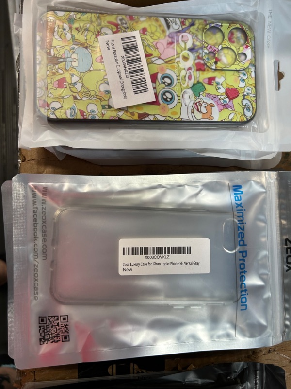 Photo 1 of **MISCELLANEOUS PHONE CASE BUNDLE**
