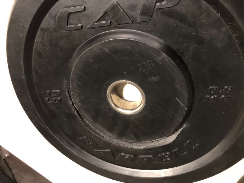 Photo 1 of ***ONE OF THE PLATES HAS MAJOR DAMAGE - SEE PICTURES***
CAP Barbell Premium Bumper Plate Set 15 lb Pair Set