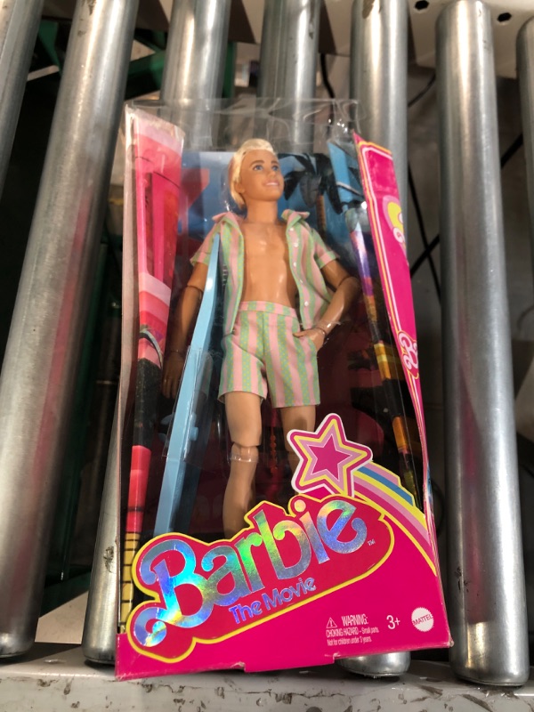 Photo 2 of Barbie The Movie Ken Doll Wearing Pastel Pink and Green Striped Beach Matching Set