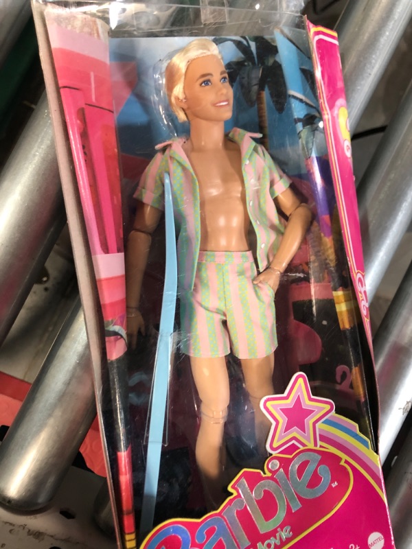 Photo 3 of Barbie The Movie Ken Doll Wearing Pastel Pink and Green Striped Beach Matching Set