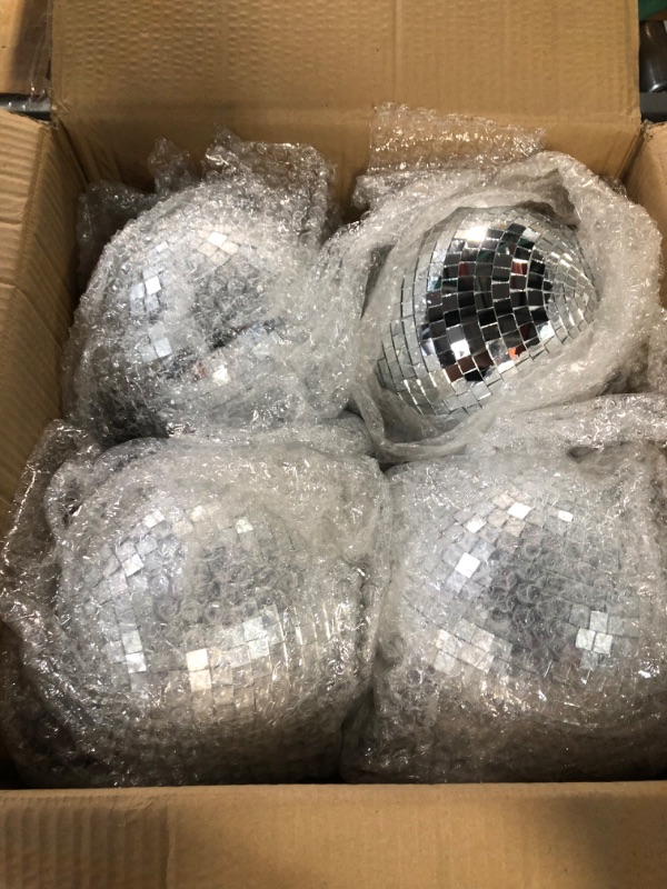 Photo 4 of **MAJOR DAMAGE TO ONE AND MINOR DAMAGE TO ANOTHER GLOBE** 4 Pack Large Disco Ball Silver Hanging Disco Balls Reflective Mirror Ball Ornament for Party Holiday Wedding Dance and Music Festivals Decor Club Stage Props DJ Decoration (8 Inch)