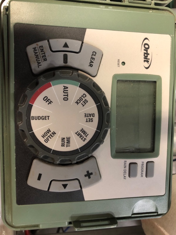 Photo 2 of **TURNS ON**
Orbit 6-Station Indoor/Outdoor Swing Panel Sprinkler System Timer, Green