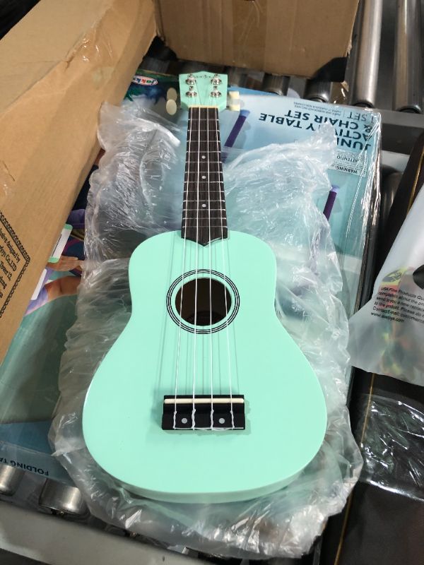 Photo 6 of ***STOCK IMAGE FOR REFERENCE ONLY***
Soprano Ukulele Beginner Kit for Kids Adult Student w/Free Online Lesson 21 Inch Ukelele Gig Bag Strap String Tuner Songbook Pick Polishing Cloth, Rainbow Series Ukalalee TURQUOISE 