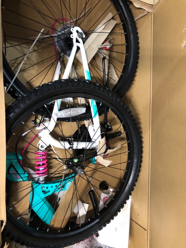 Photo 2 of **FOR PARTS OR REPAIR**SEE NOTES**
Dynacraft Vertical Dual Suspension Mountain Bike Girls 24 Inch Wheels with 18 Speed Grip Shiter and Dual Hand Brakes in Teal and Pink