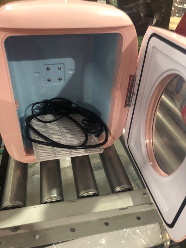 Photo 3 of * used with damage on the door *
FRIGIDAIRE EFMIS462-PINK 12 Can Retro Mini Portable Personal Fridge/Cooler for Home, 