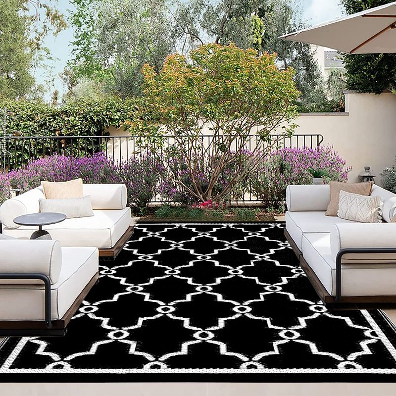 Photo 1 of OutdoorLines Outdoor Reversible Rugs for Patio 5x8 ft - Outside Plastic Carpet, Stain & UV Resistant Portable RV Mat, Straw Rug for Camping, Backyard, Deck, Picnic, Porch Moroccan Flower Black & White 5’x8’ Moroccan Flower/Black & White