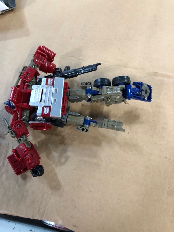 Photo 4 of **LEG BROKEN** QCCX Car Robot Toys, Deformation Robot Toy, Optimus Action Figure, Deformed Car Robot with Weapon for Kids Boys Girls