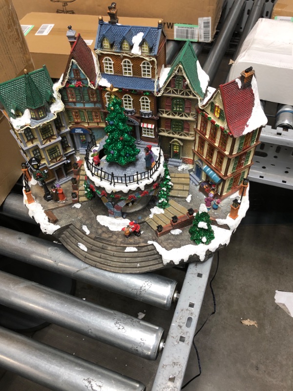 Photo 2 of "NOT FUNCTIONAL, FOR PARTS ONLY" Christmas Village House Decoration,Colourful LED Lights Light Up Streets and Buildings,Rotating Christmas Trees and Roller Skaters,Music Rendering Atmosphere Colorful a