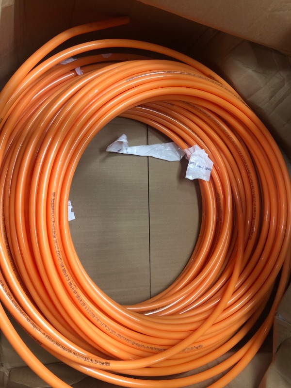 Photo 1 of SharkBite 3/8 Inch x 100 Feet Orange PEX Pipe, Oxygen Barrier Flexible Water Tubing for Radiant Heating, U855O100
