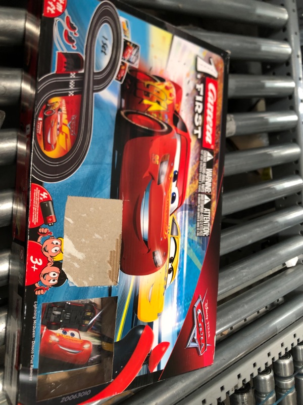 Photo 1 of Carrera First Disney/Pixar Cars 3 - Slot Car Race Track - Includes 2 cars: Lightning McQueen and Dinoco Cruz - Battery-Powered Beginner Racing Set for Kids Ages 3 Years and Up