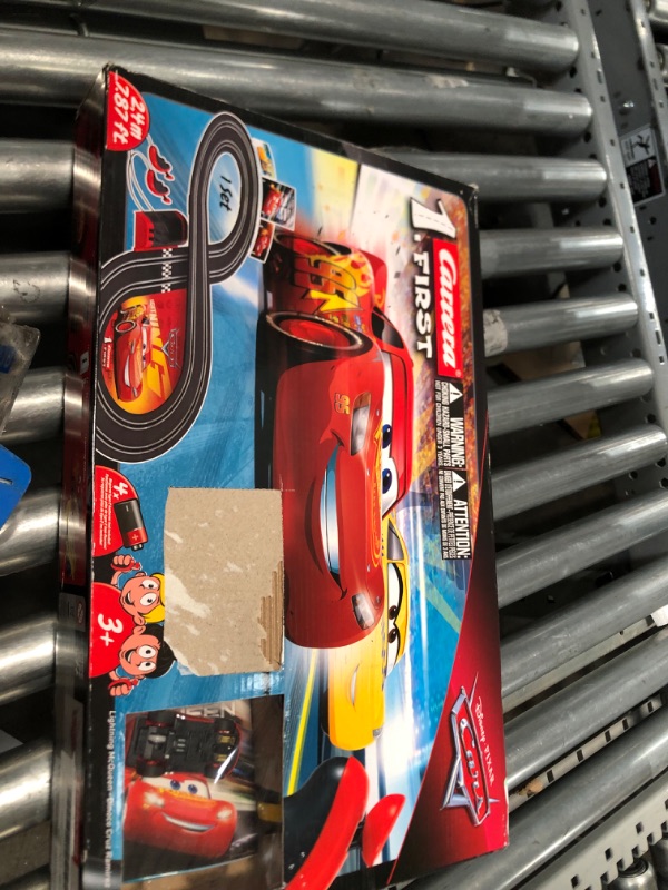 Photo 1 of Carrera First Disney/Pixar Cars 3 - Slot Car Race Track - Includes 2 cars: Lightning McQueen and Dinoco Cruz - Battery-Powered Beginner Racing Set for Kids Ages 3 Years and Up
