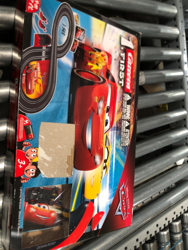 Photo 1 of Carrera First Disney/Pixar Cars 3 - Slot Car Race Track - Includes 2 cars: Lightning McQueen and Dinoco Cruz - Battery-Powered Beginner Racing Set for Kids Ages 3 Years and Up