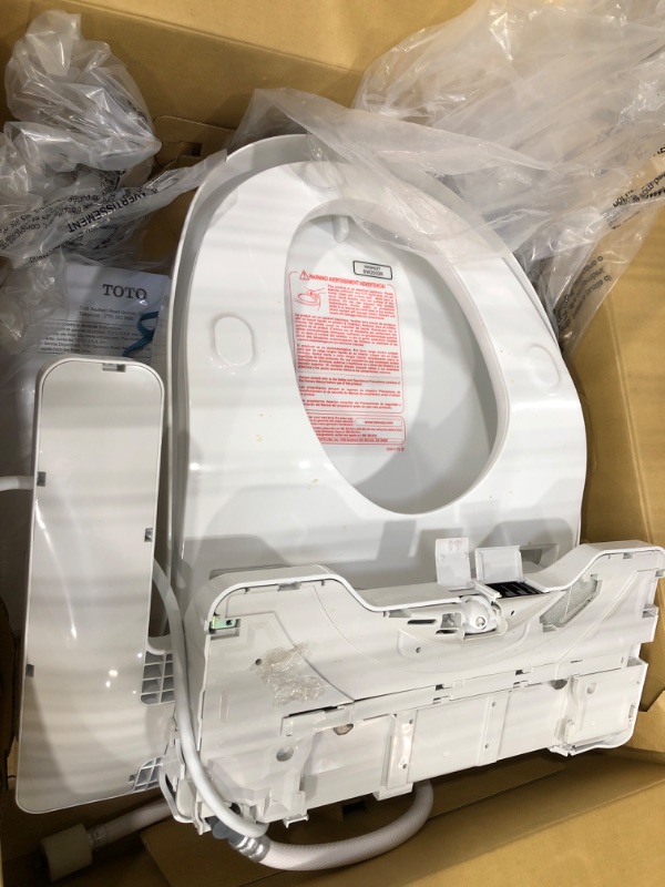 Photo 3 of **POWER LIGHT FLASHES WHEN ON** TOTO SW2033R#01 C100 Electronic Bidet Toilet Cleansing Water, Heated Seat, Deodorizer, Warm Air Dryer, and PREMIST, Round, Cotton White
