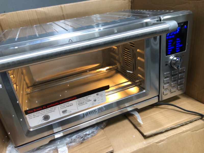 Photo 2 of **MINOR DAMAGE TO BACK** Nuwave Bravo XL Air Fryer Toaster Smart Oven, 12-in-1 Countertop Grill/Griddle Combo, 30-Qt XL Capacity, 50F-500F adjustable in precise 5F increments. Integrated Smart Thermometer, Linear T Technology
