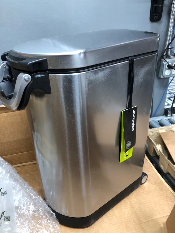 Photo 2 of **SMALL DENT ON SIDE** simplehuman 25 Liter, 27lb / 12.2 kg Medium Pet Food Storage Container, Brushed Stainless Steel for Dog ,Cat Food, and Bird Feed
